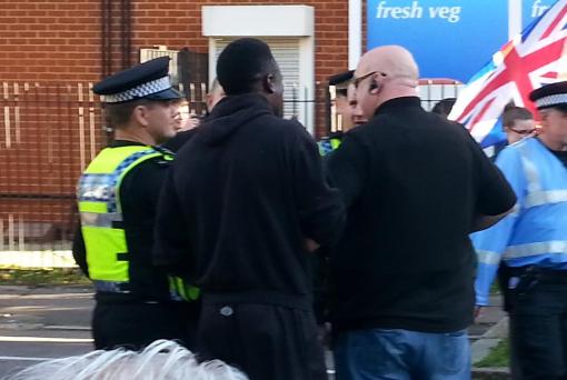 Paul Golding and his security team thugs attempt to start a fight with a black army reservist who called them racist.